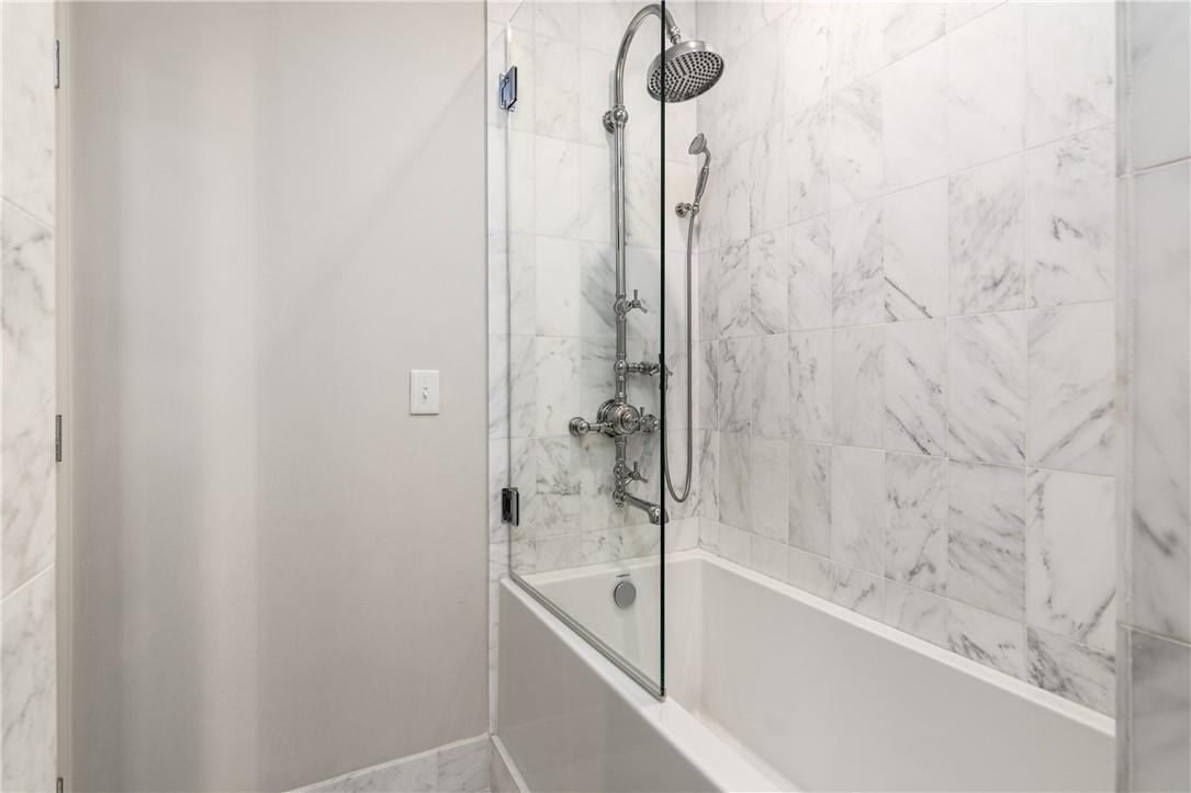 866 Cherokee Road Charlotte, NC 28207 - Photo 25 of 35 a bathroom with a bathtub and shower