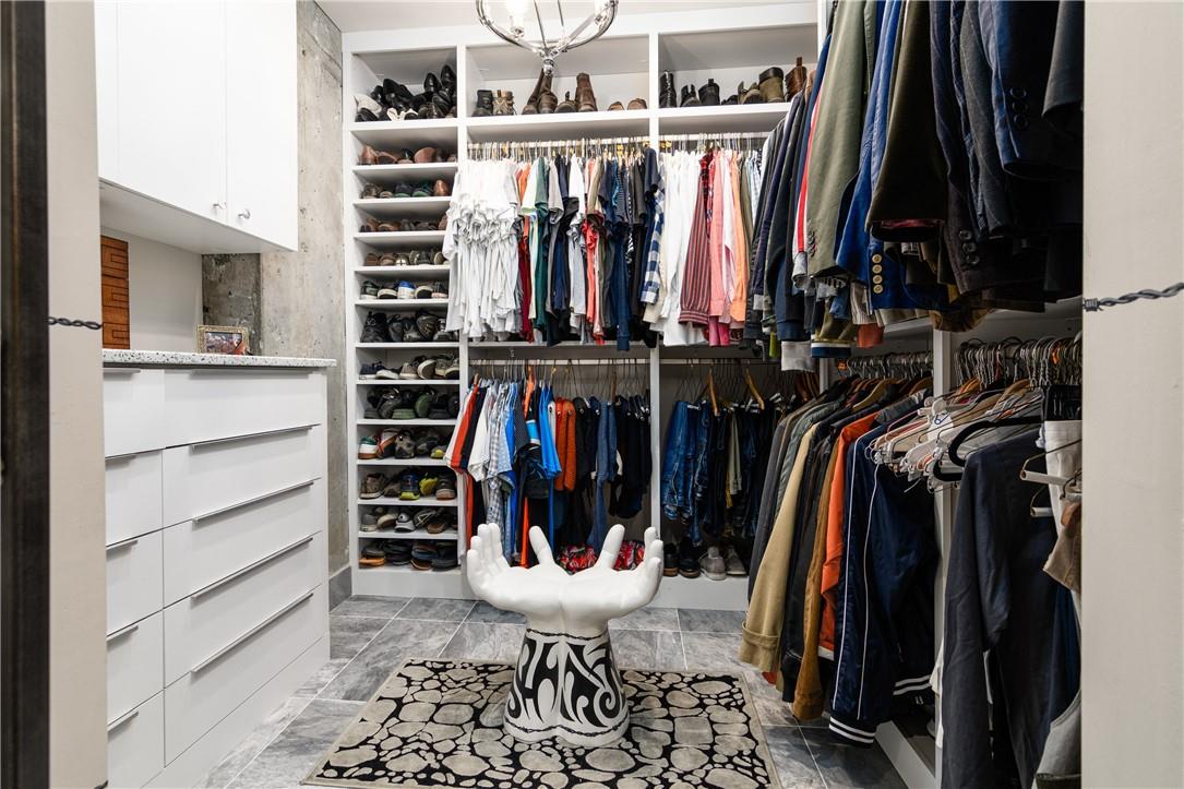 866 Cherokee Road Charlotte, NC 28207 - Photo 30 of 35 a view of walk in closet with clothes and shoes