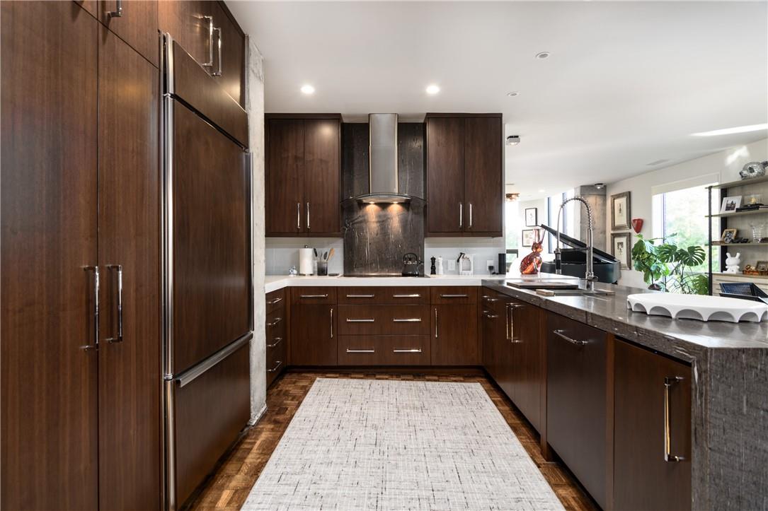 866 Cherokee Road Charlotte, NC 28207 - Photo 6 of 35 a kitchen with a sink stainless steel appliances and cabinets
