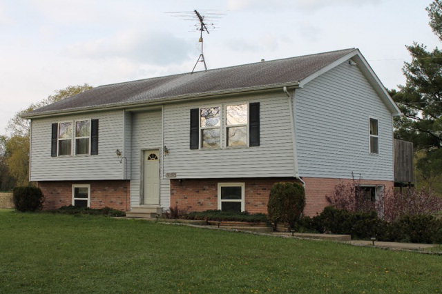32792 Teepleville Road Centerville, PA 16404 - Photo 1 of 1 a front view of a house with a garden