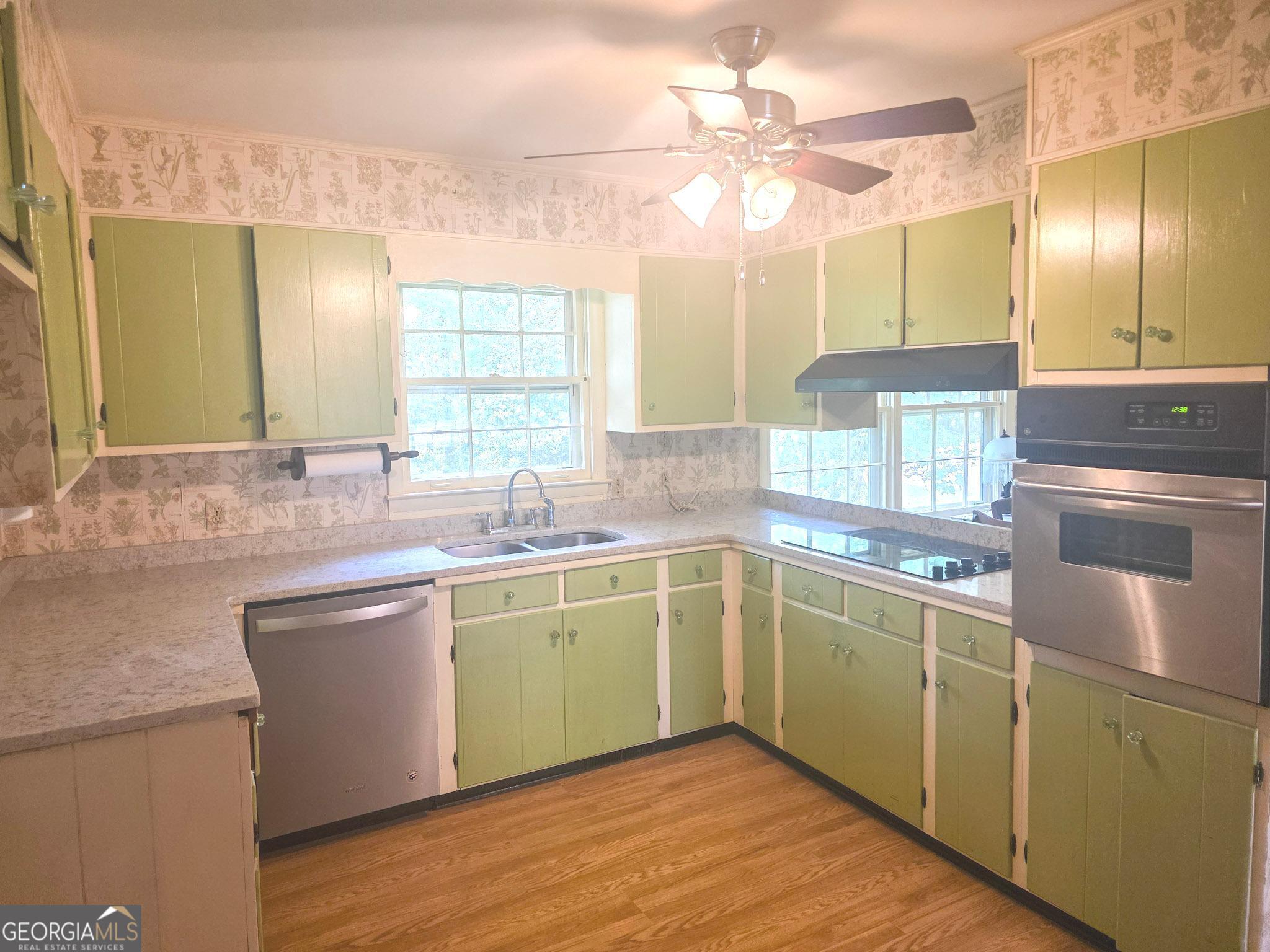1712 Briarcliff Road Milledgeville, GA 31061 - Photo 12 of 44 a kitchen with lots of counter top space sink and a window