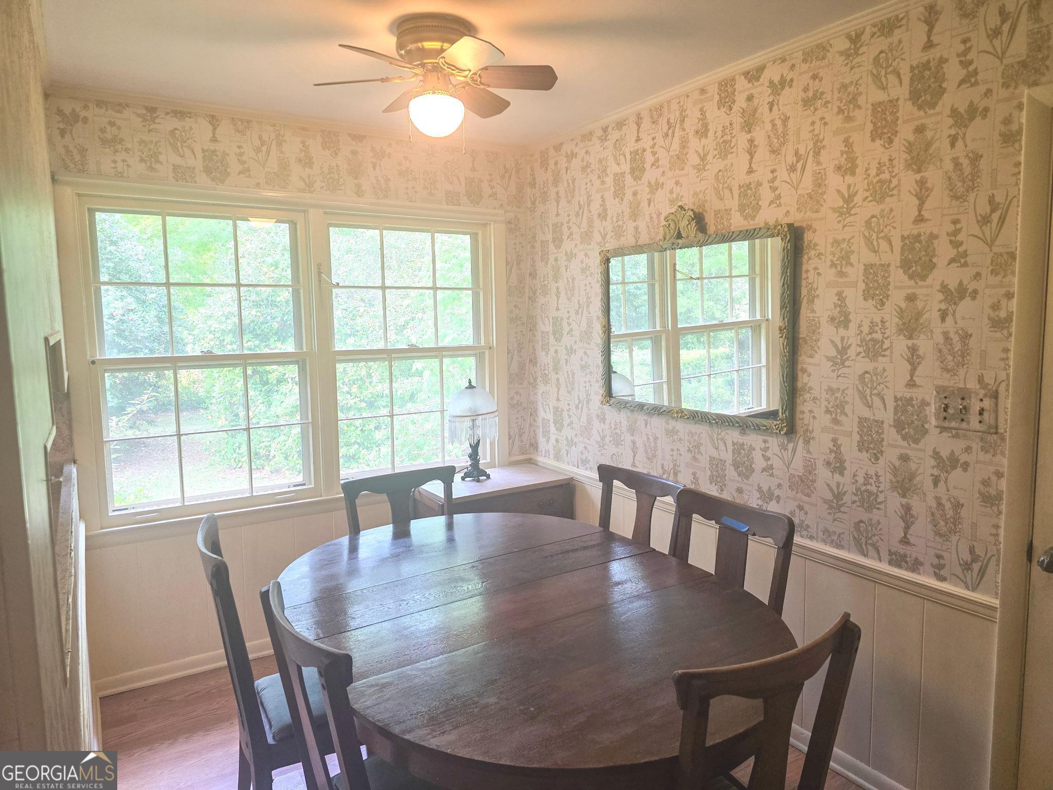 1712 Briarcliff Road Milledgeville, GA 31061 - Photo 16 of 44 a view of a dining room with furniture and a large window
