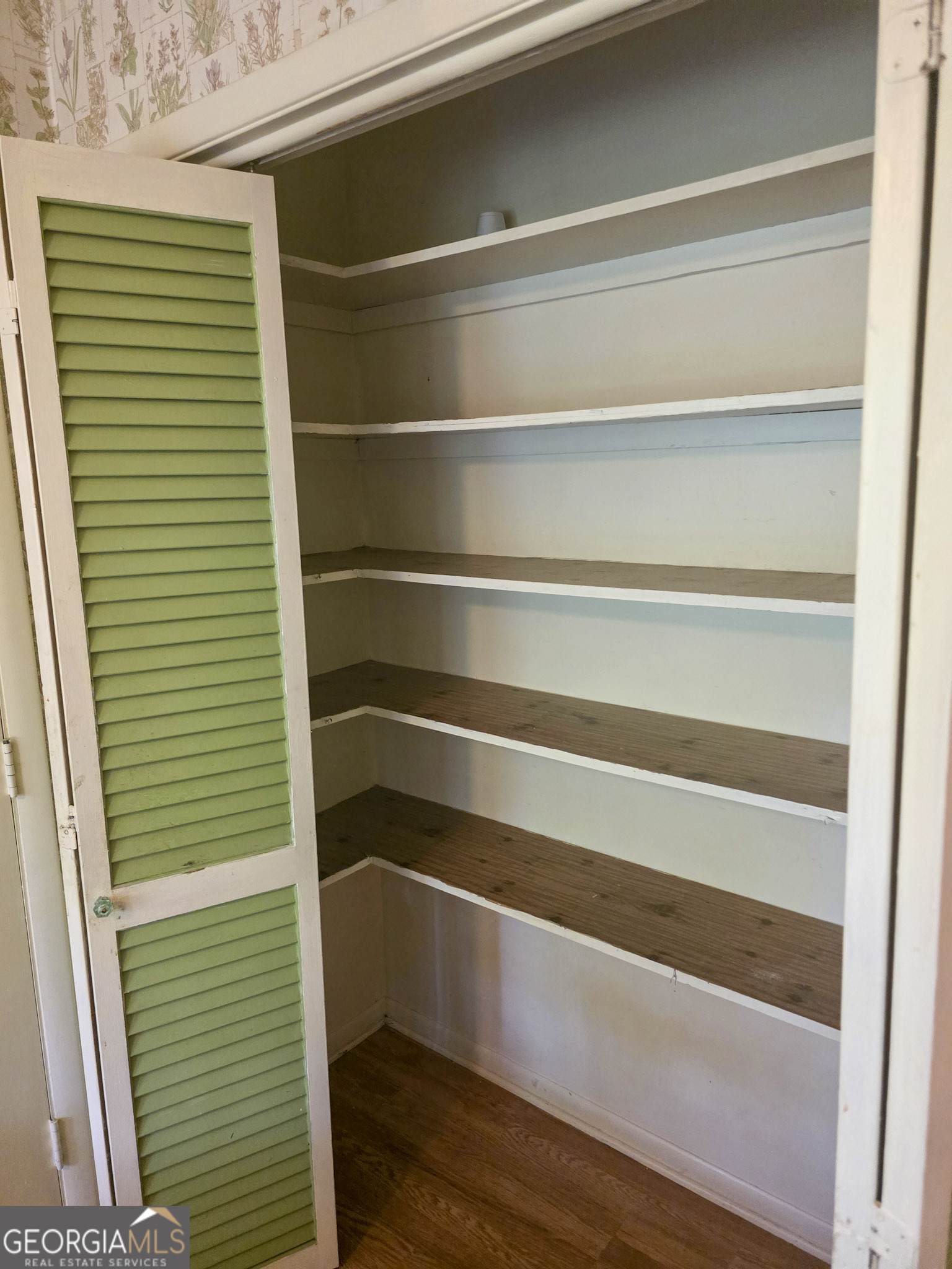 1712 Briarcliff Road Milledgeville, GA 31061 - Photo 17 of 44 a view of walk in closet with empty racks