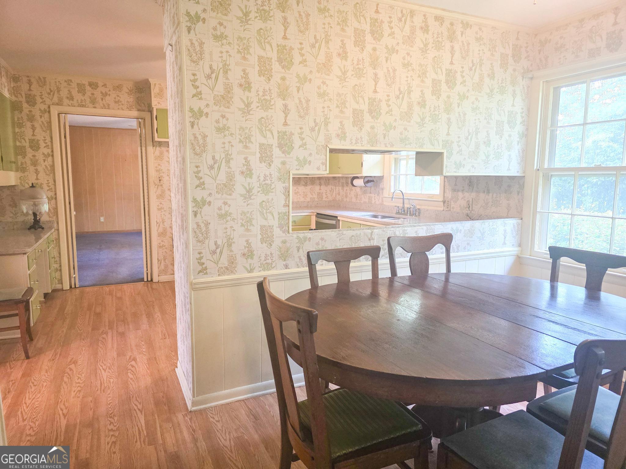 1712 Briarcliff Road Milledgeville, GA 31061 - Photo 19 of 44 a dining room with furniture and wooden floor