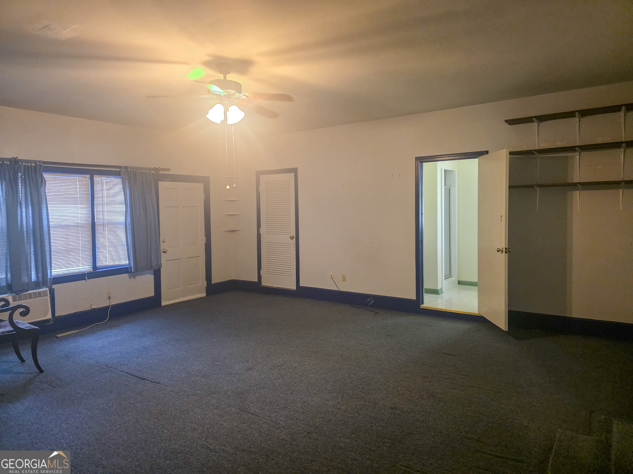 1712 Briarcliff Road Milledgeville, GA 31061 - Photo 22 of 44 a view of empty room with windows