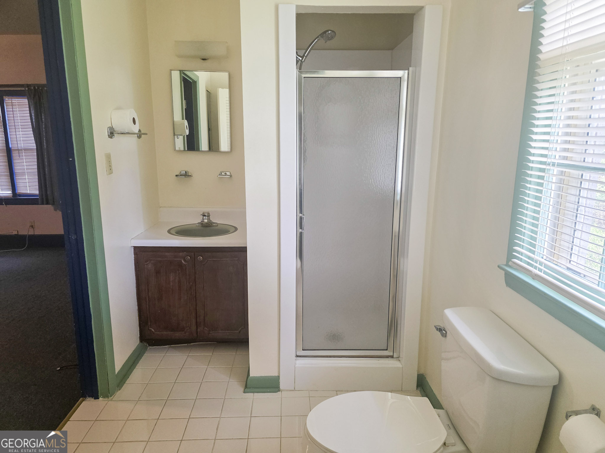 1712 Briarcliff Road Milledgeville, GA 31061 - Photo 23 of 44 a bathroom with a toilet a sink and shower