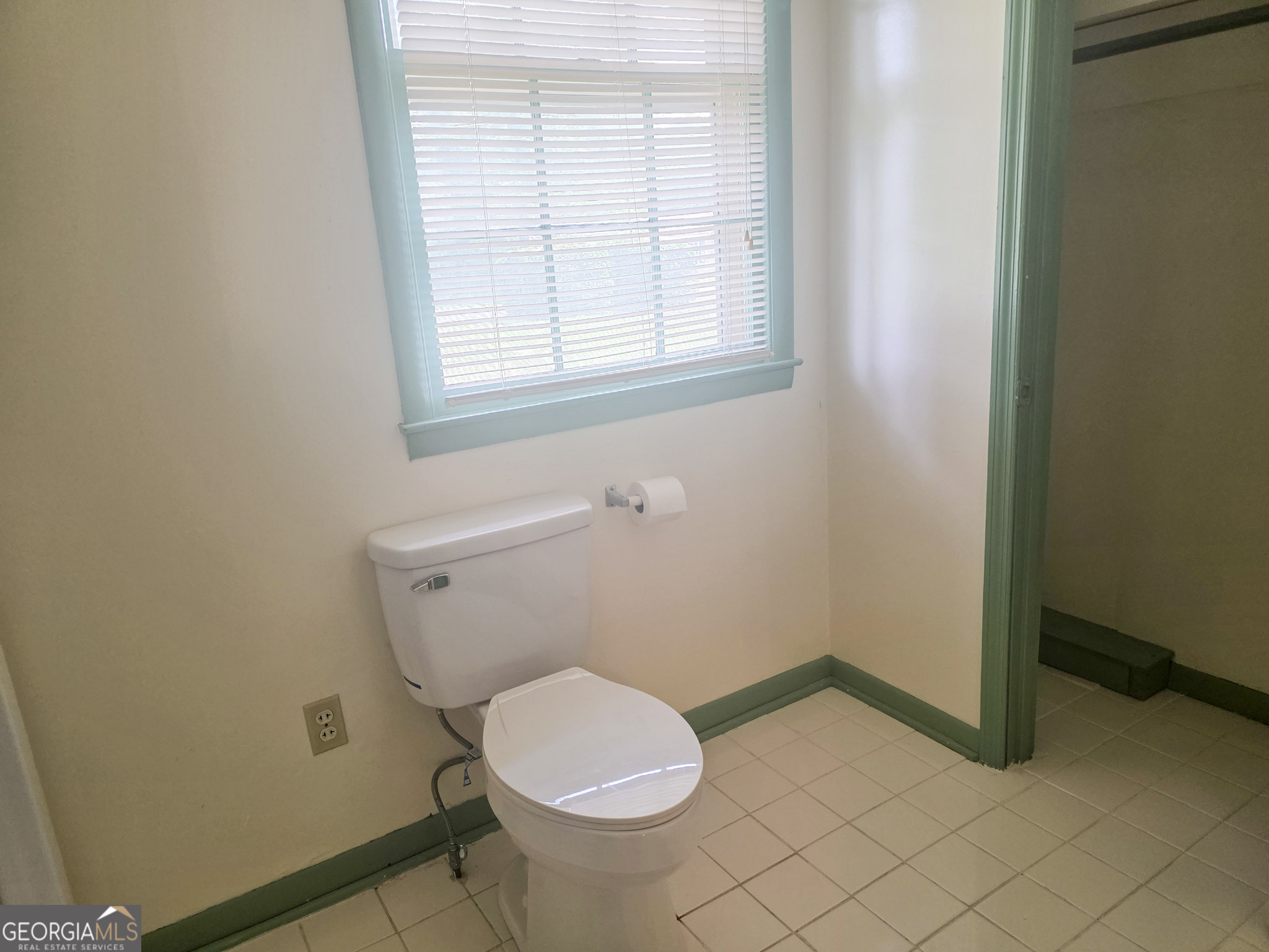 1712 Briarcliff Road Milledgeville, GA 31061 - Photo 24 of 44 a white toilet sitting in a bathroom next to a window