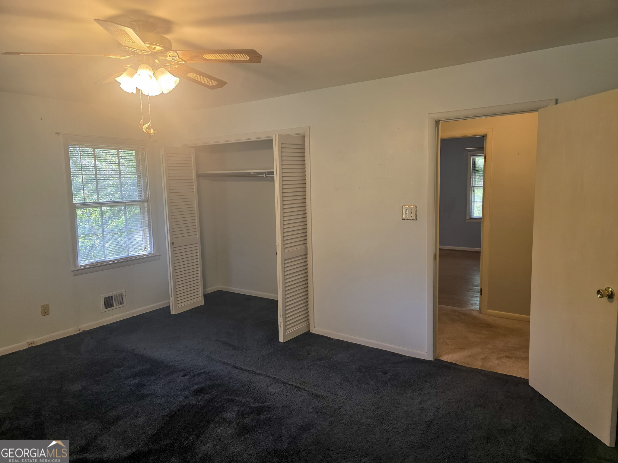 1712 Briarcliff Road Milledgeville, GA 31061 - Photo 30 of 44 en empty room with windows and closet