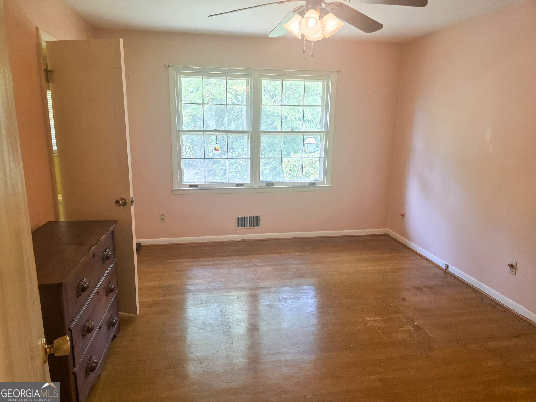 1712 Briarcliff Road Milledgeville, GA 31061 - Photo 41 of 44 an empty room with wooden floor and windows