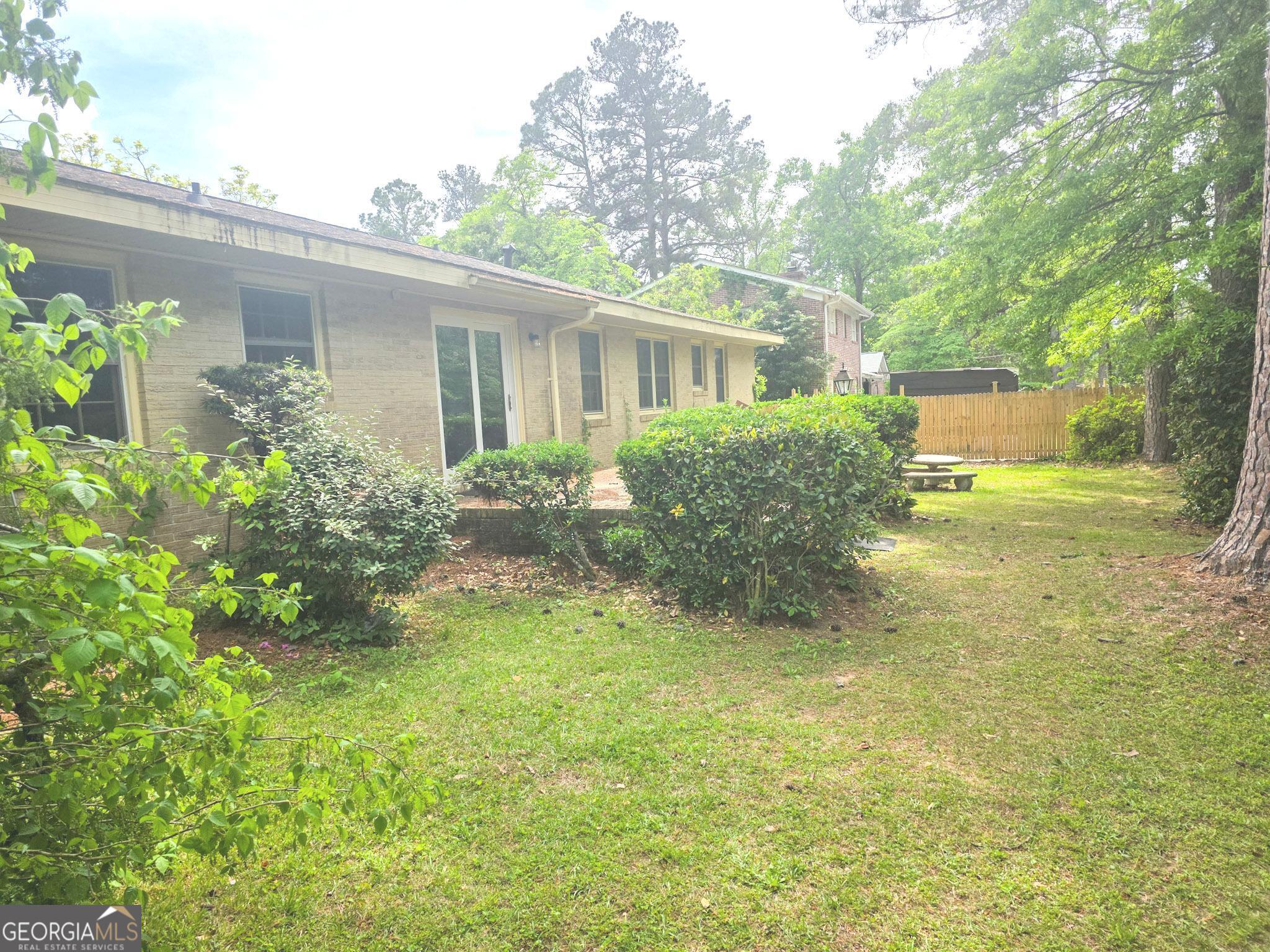1712 Briarcliff Road Milledgeville, GA 31061 - Photo 8 of 44 a view of a house with a garden