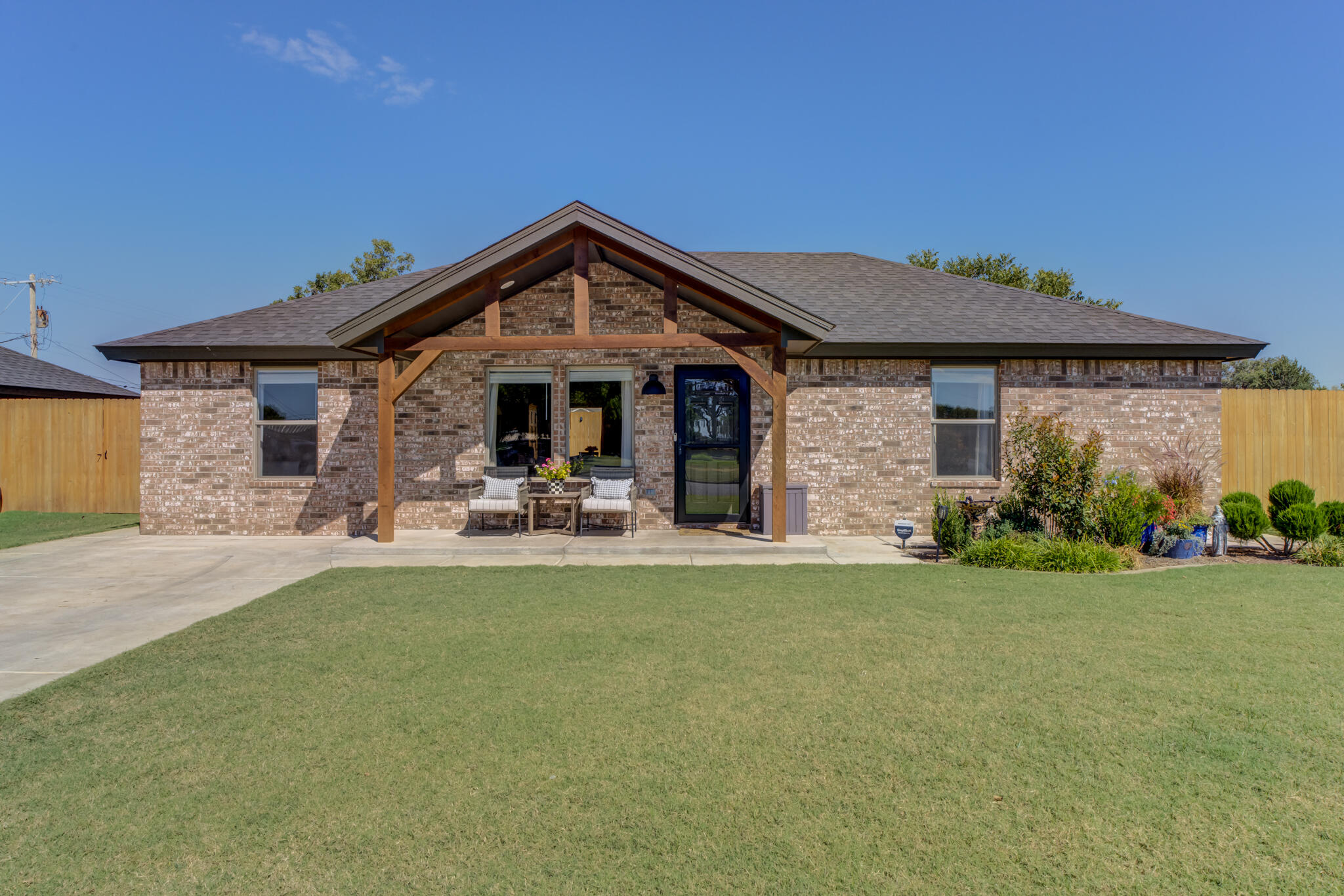 a view of a house with swimming pool and a yard