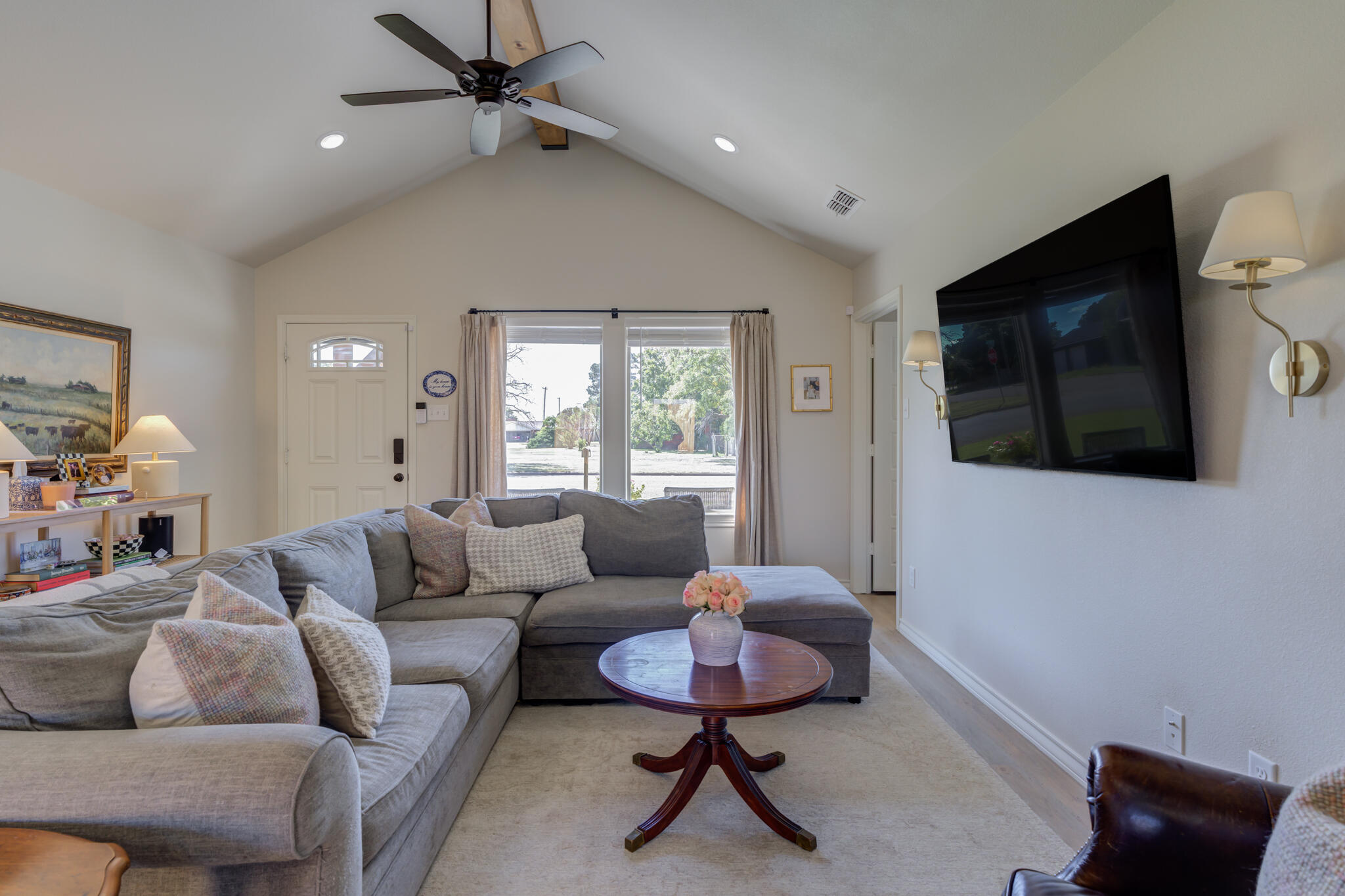804 2nd Street Abernathy, TX 79311 - Photo 11 of 40 a living room with furniture and a flat screen tv
