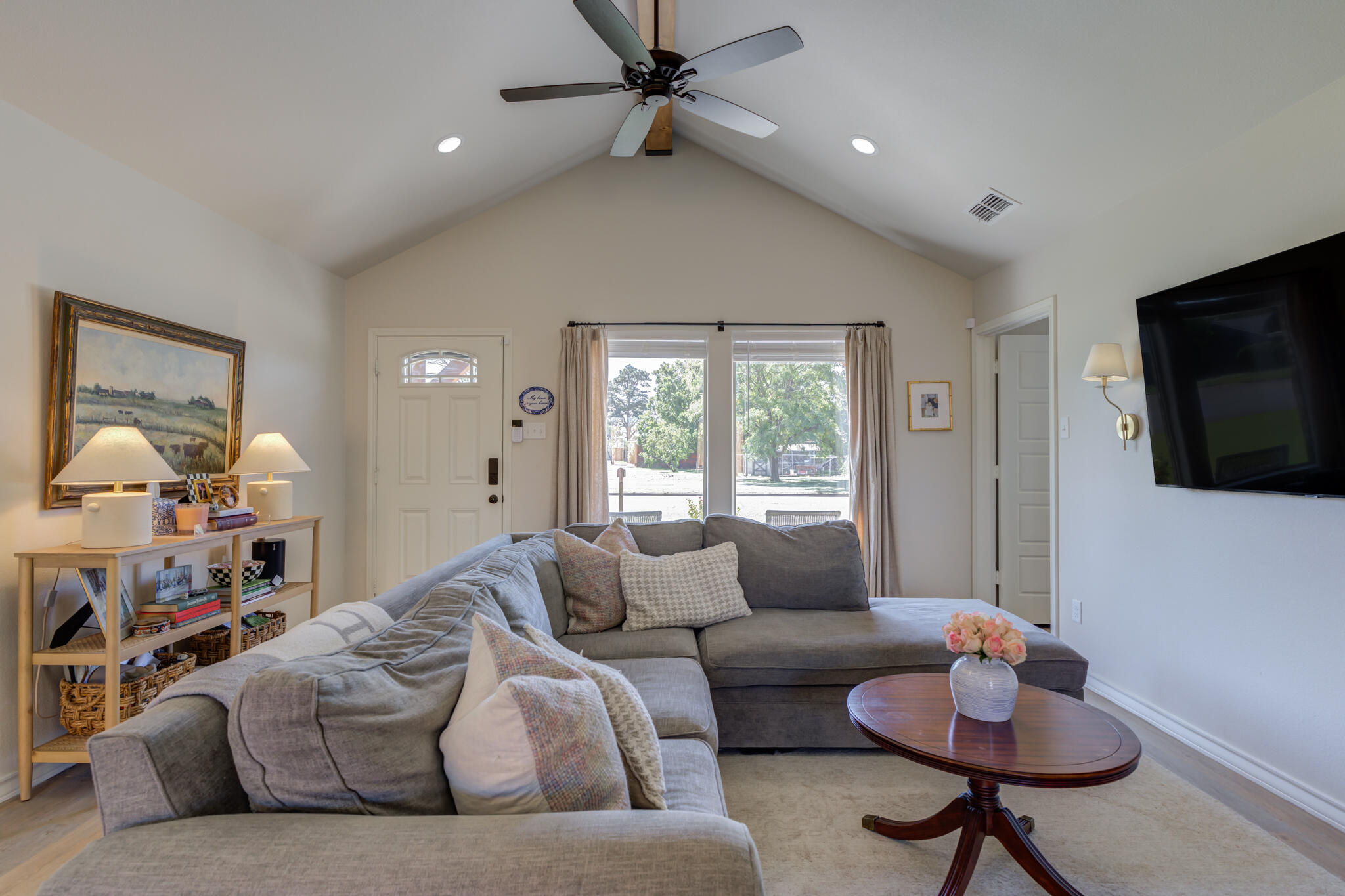 804 2nd Street Abernathy, TX 79311 - Photo 12 of 40 a living room with furniture and a flat screen tv