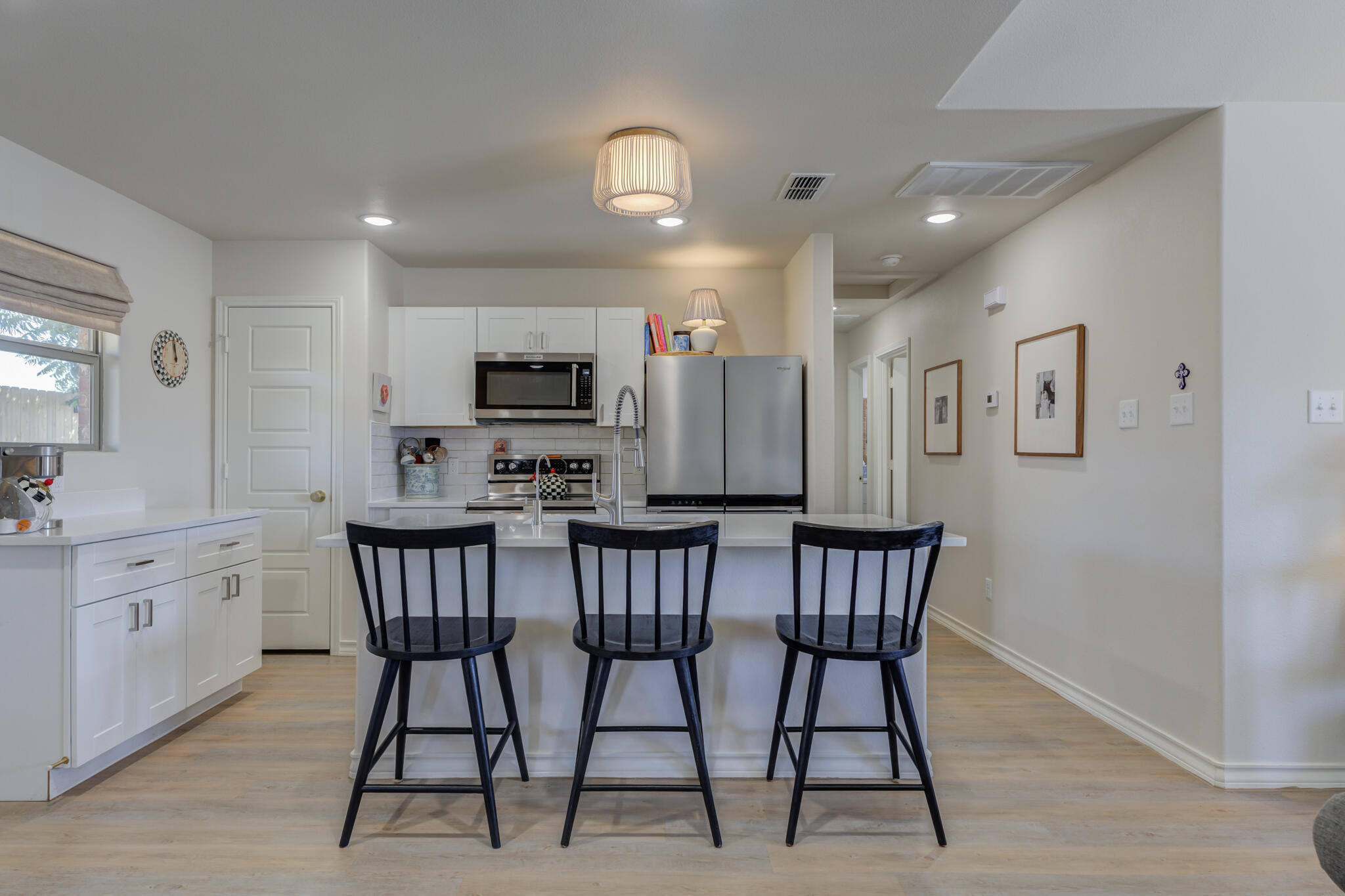 804 2nd Street Abernathy, TX 79311 - Photo 16 of 40 a view of kitchen with furniture and wooden floor