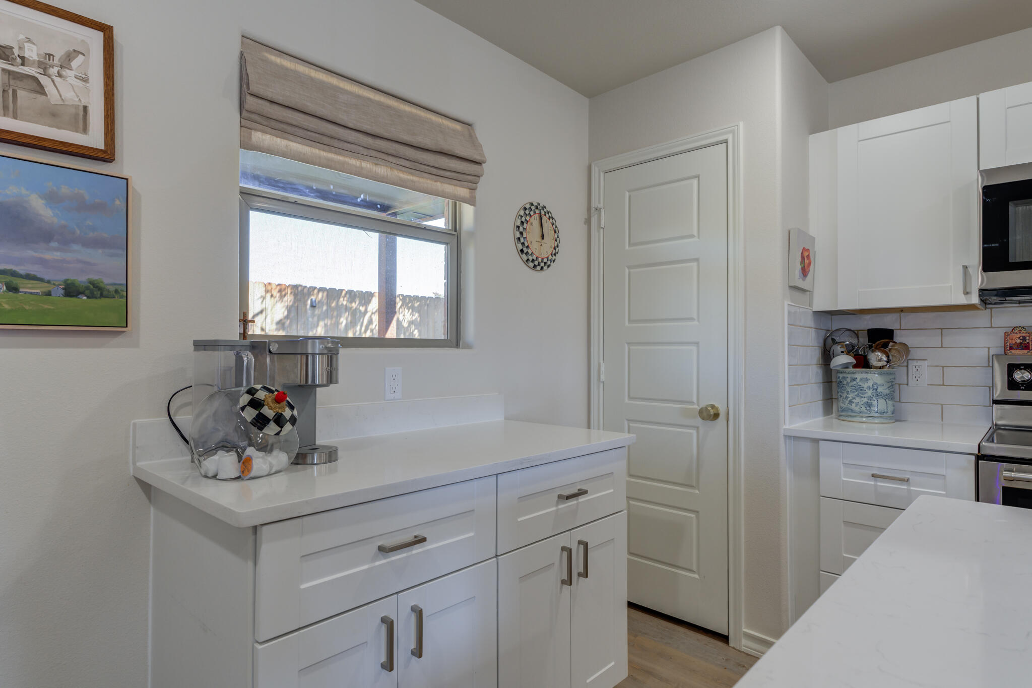 804 2nd Street Abernathy, TX 79311 - Photo 18 of 40 a kitchen with white cabinets and sink