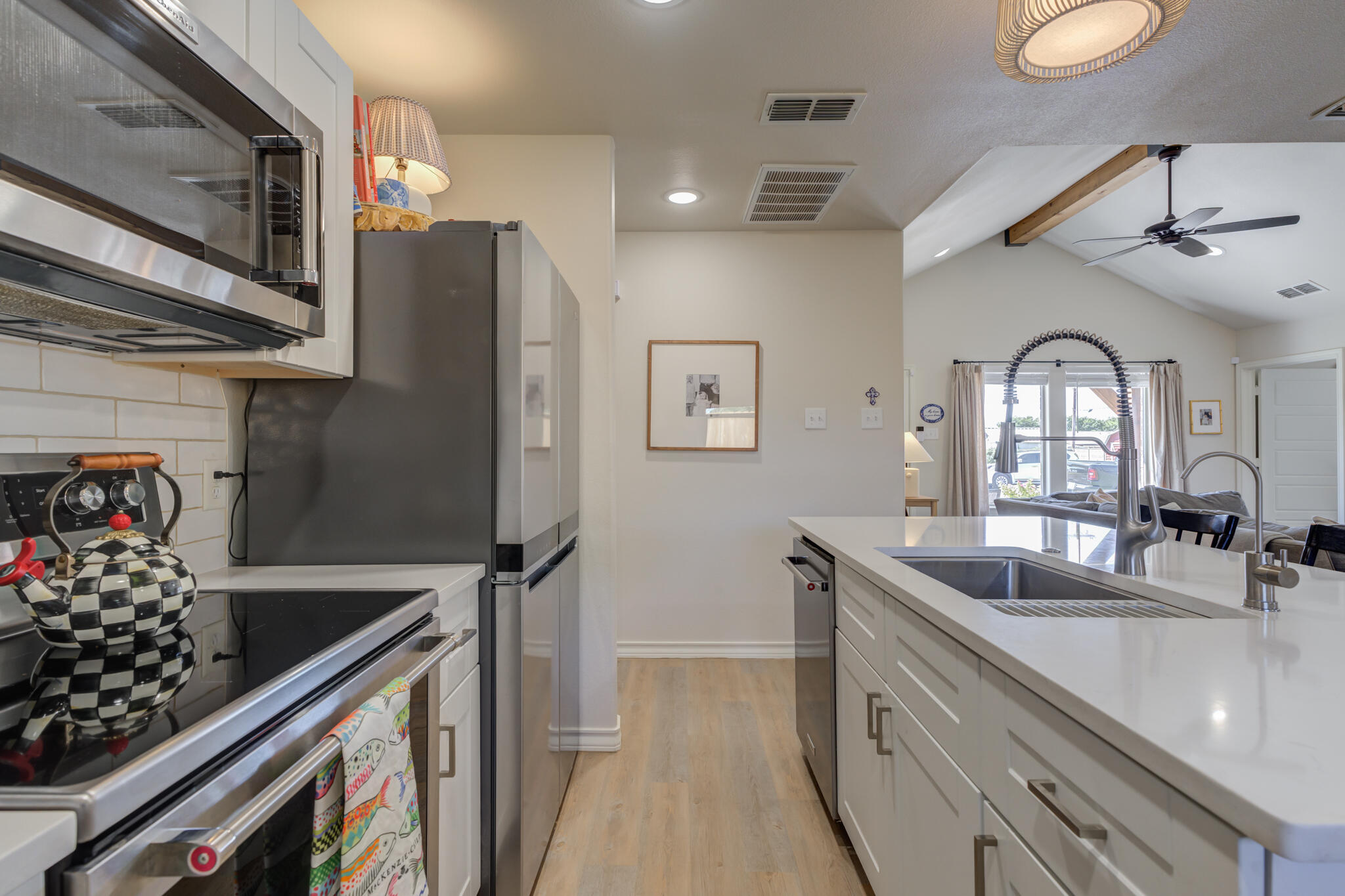 804 2nd Street Abernathy, TX 79311 - Photo 22 of 40 a kitchen with stainless steel appliances granite countertop a sink and a refrigerator
