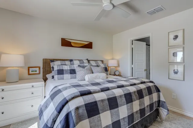 a bedroom with a bed and dresser