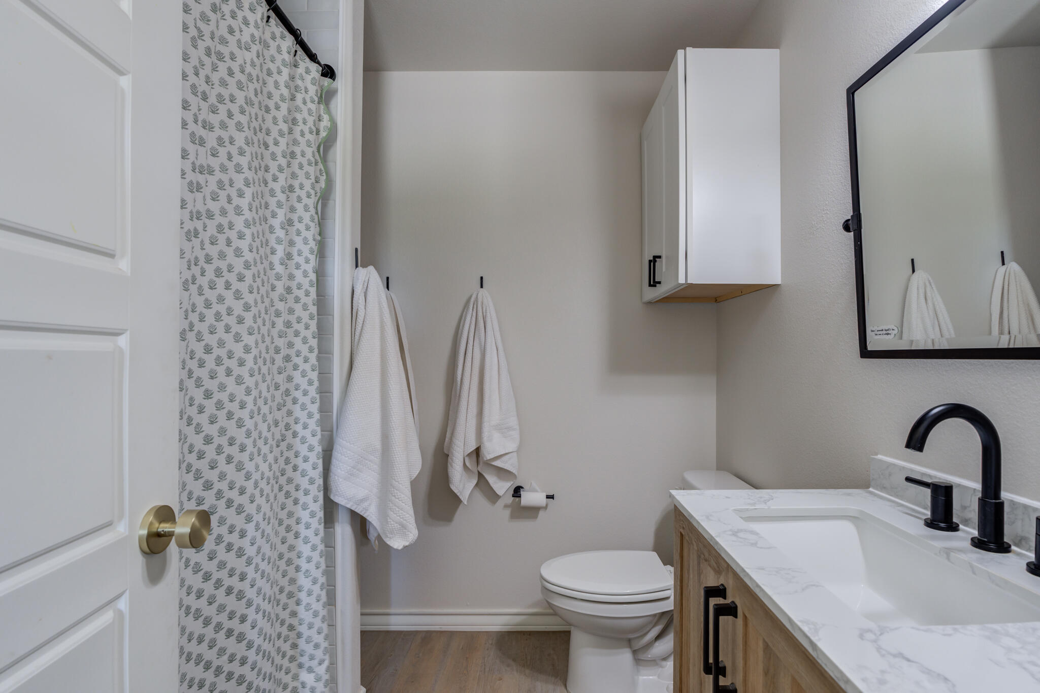 804 2nd Street Abernathy, TX 79311 - Photo 25 of 40 a bathroom with a sink toilet and shower