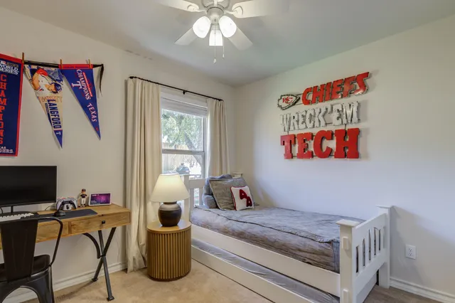 a bedroom with furniture and a window