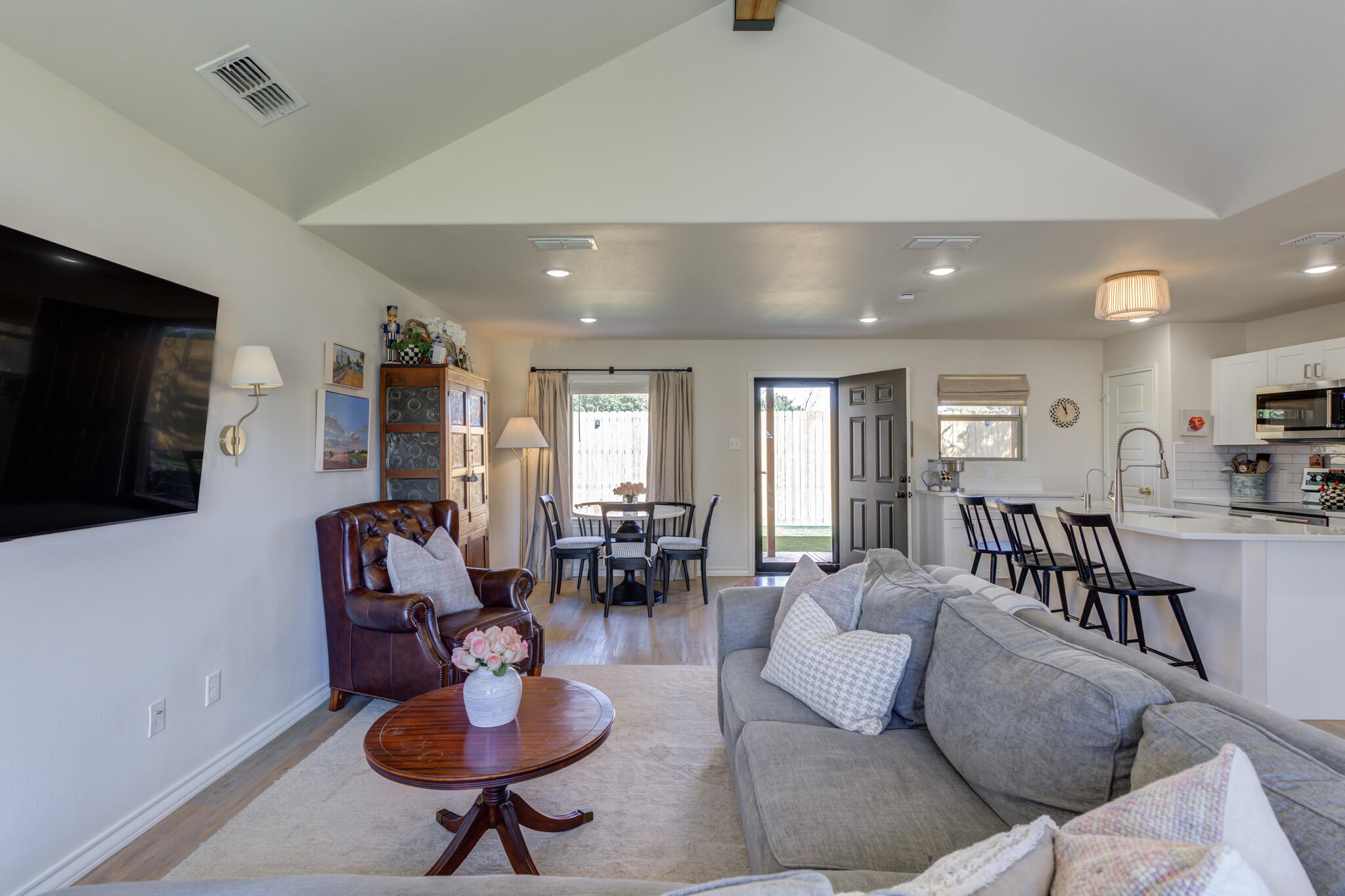 804 2nd Street Abernathy, TX 79311 - Photo 7 of 40 a living room with furniture a flat screen tv and a window