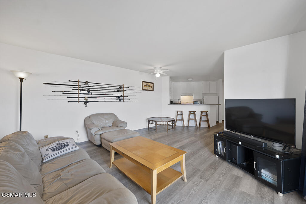 2901 Peninsula Road, Unit 137 Oxnard, CA 93035 - Photo 11 of 36 a living room with furniture and a flat screen tv