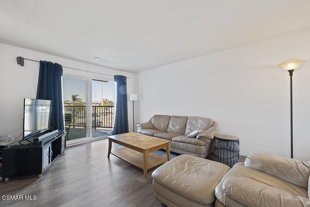 2901 Peninsula Road, Unit 137 Oxnard, CA 93035 - Photo 13 of 36 a living room with furniture and a flat screen tv