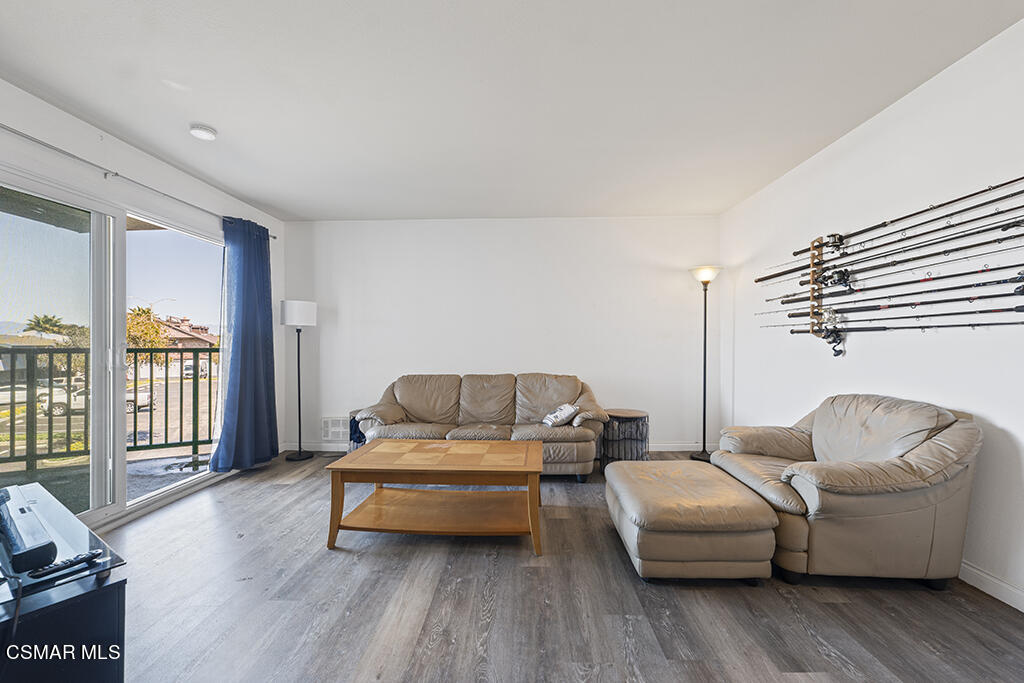 2901 Peninsula Road, Unit 137 Oxnard, CA 93035 - Photo 14 of 36 a living room with furniture and a wooden floor