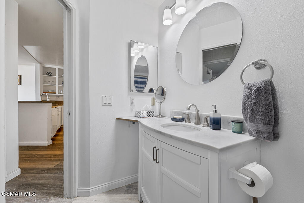 2901 Peninsula Road, Unit 137 Oxnard, CA 93035 - Photo 18 of 36 a bathroom with a sink and a mirror