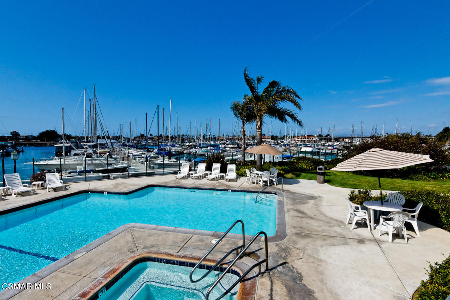 2901 Peninsula Road, Unit 137 Oxnard, CA 93035 - Photo 23 of 36 a view of a swimming pool with chairs