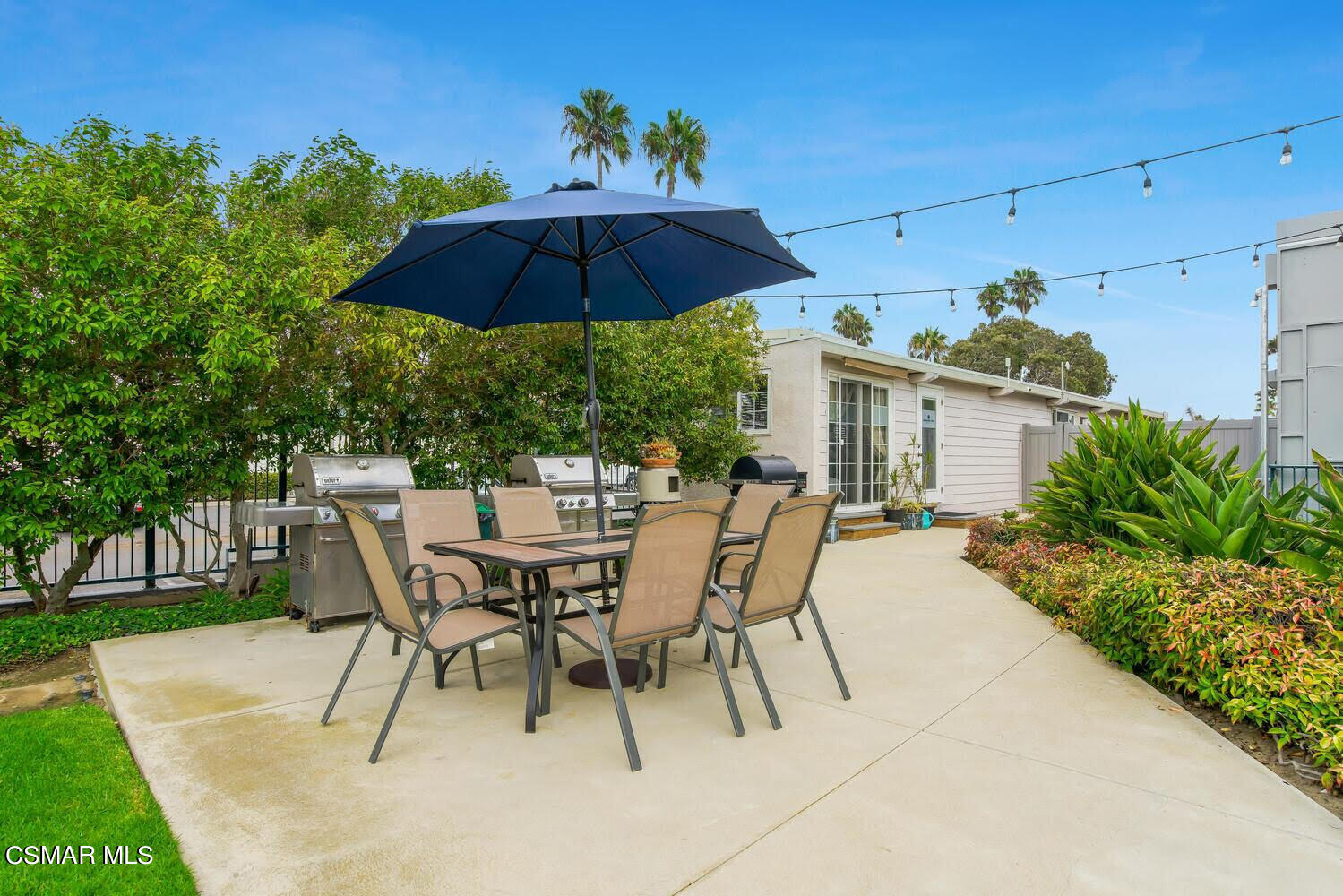 2901 Peninsula Road, Unit 137 Oxnard, CA 93035 - Photo 26 of 36 a patio with a patio table and chairs