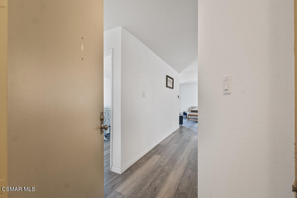 2901 Peninsula Road, Unit 137 Oxnard, CA 93035 - Photo 6 of 36 a view of a hallway with wooden floor