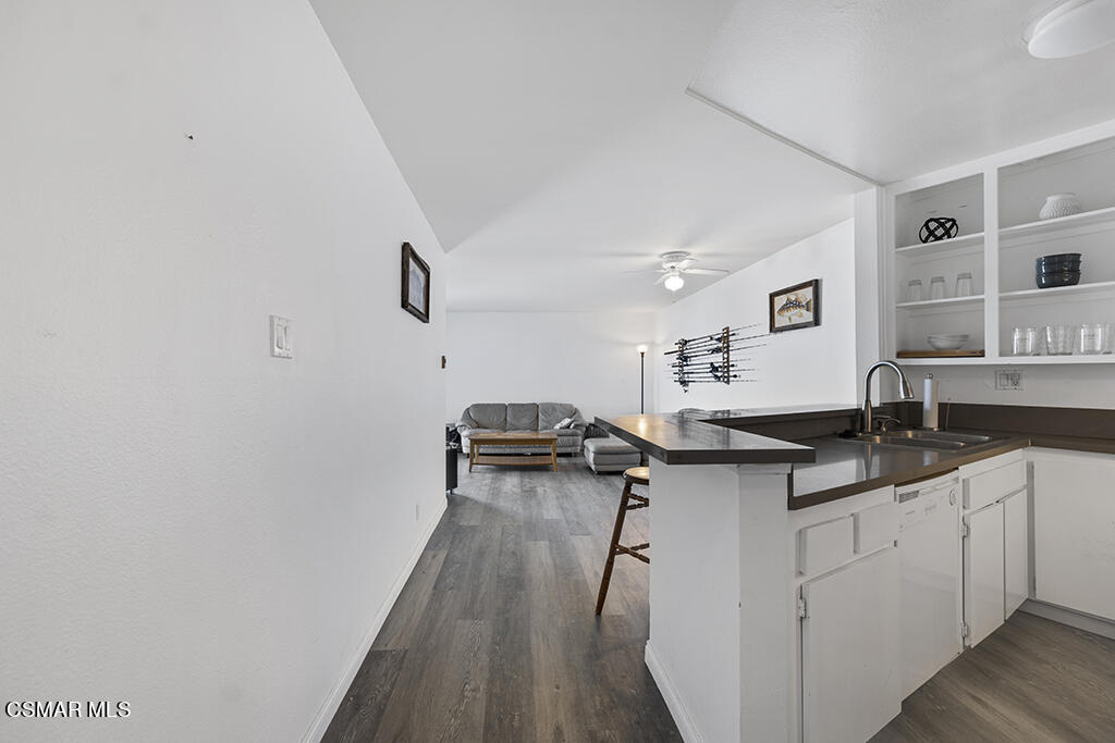 2901 Peninsula Road, Unit 137 Oxnard, CA 93035 - Photo 7 of 36 a kitchen with granite countertop a sink a stove and cabinets