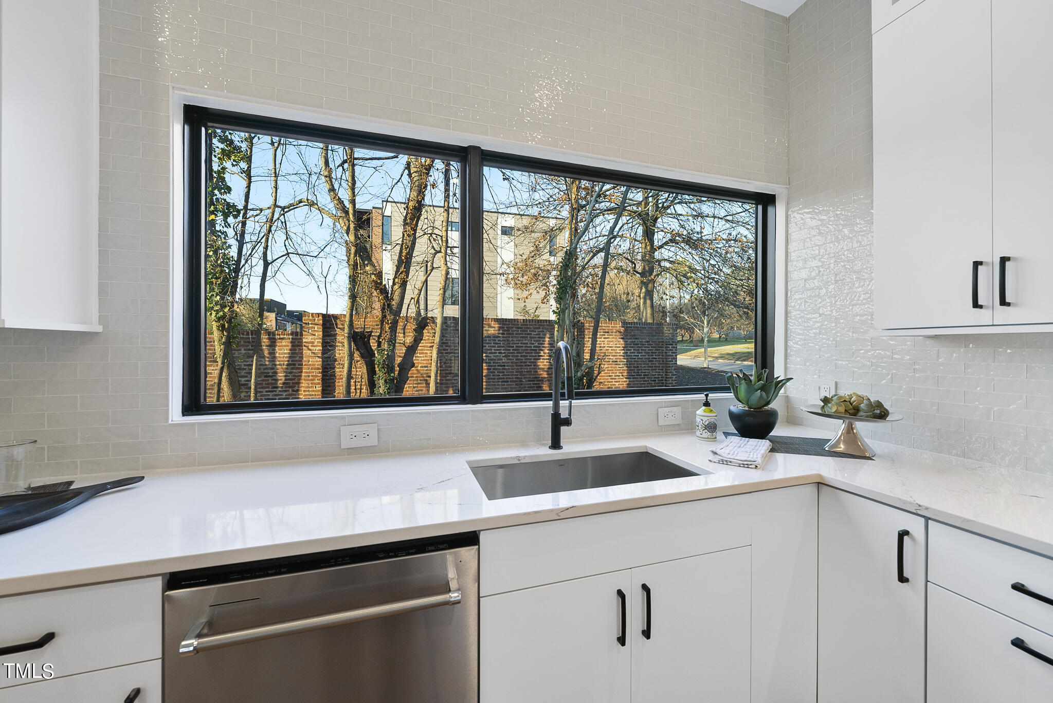 517 East Cabarrus Street Raleigh, NC 27601 - Photo 18 of 58 a kitchen with a sink and a window