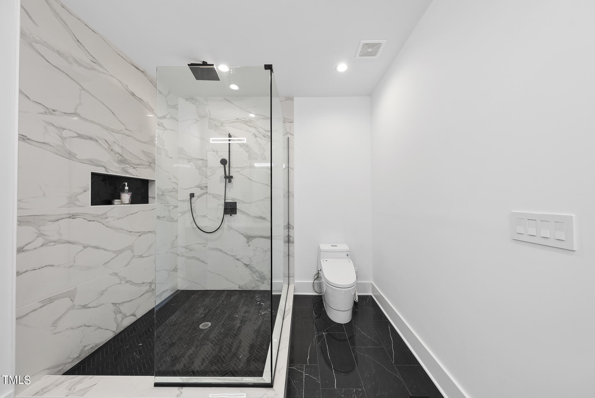 517 East Cabarrus Street Raleigh, NC 27601 - Photo 28 of 58 a bathroom with a toilet and a shower