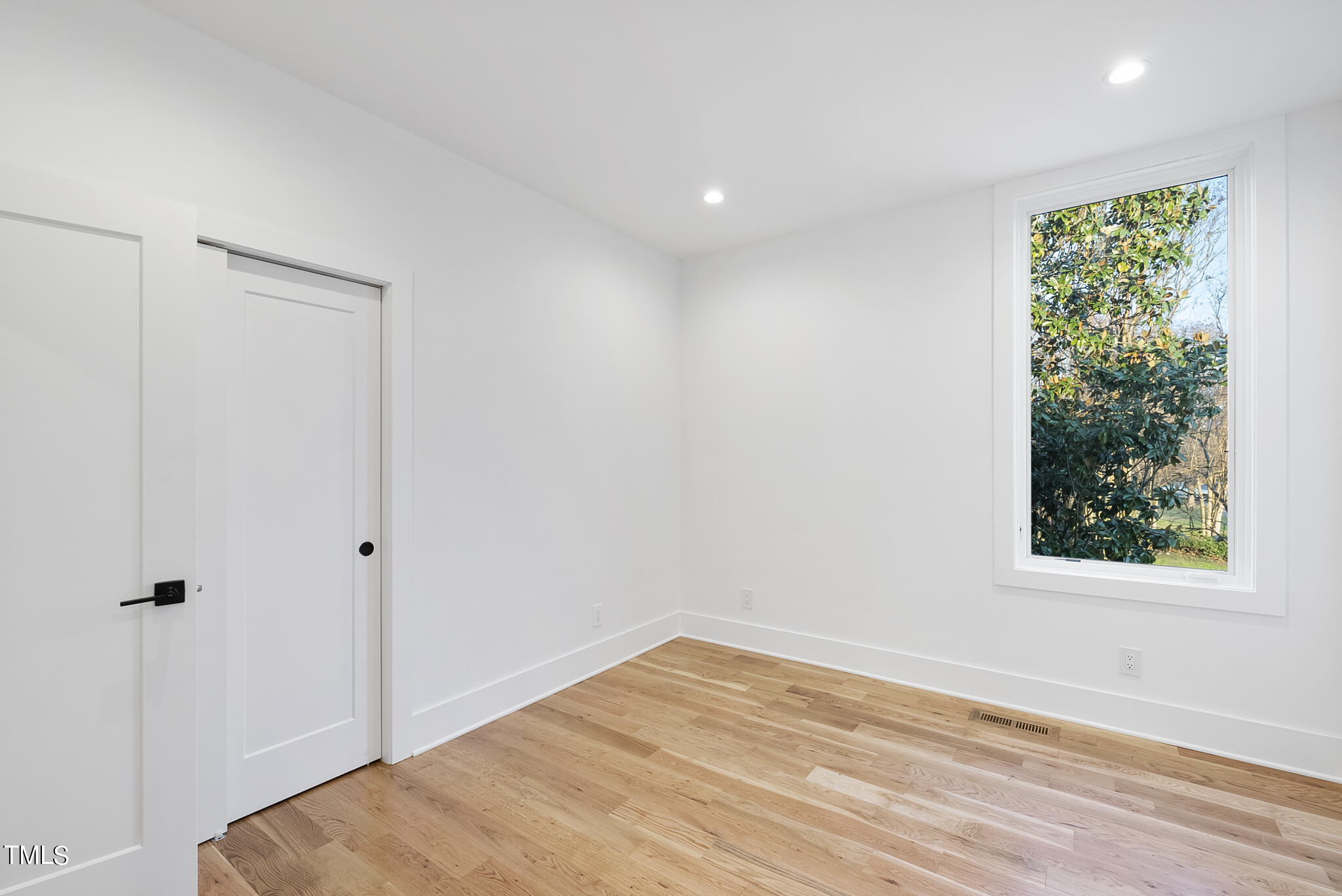 517 East Cabarrus Street Raleigh, NC 27601 - Photo 37 of 58 a view of empty room with wooden floor and fan