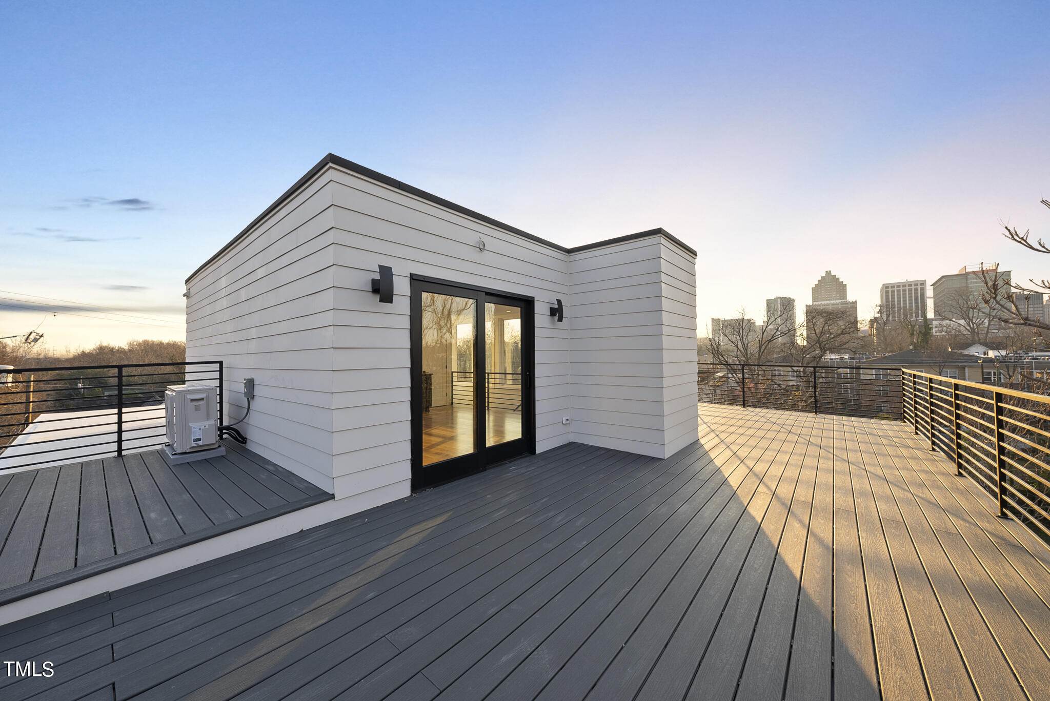 517 East Cabarrus Street Raleigh, NC 27601 - Photo 52 of 58 a view of a terrace with wooden floor and fence