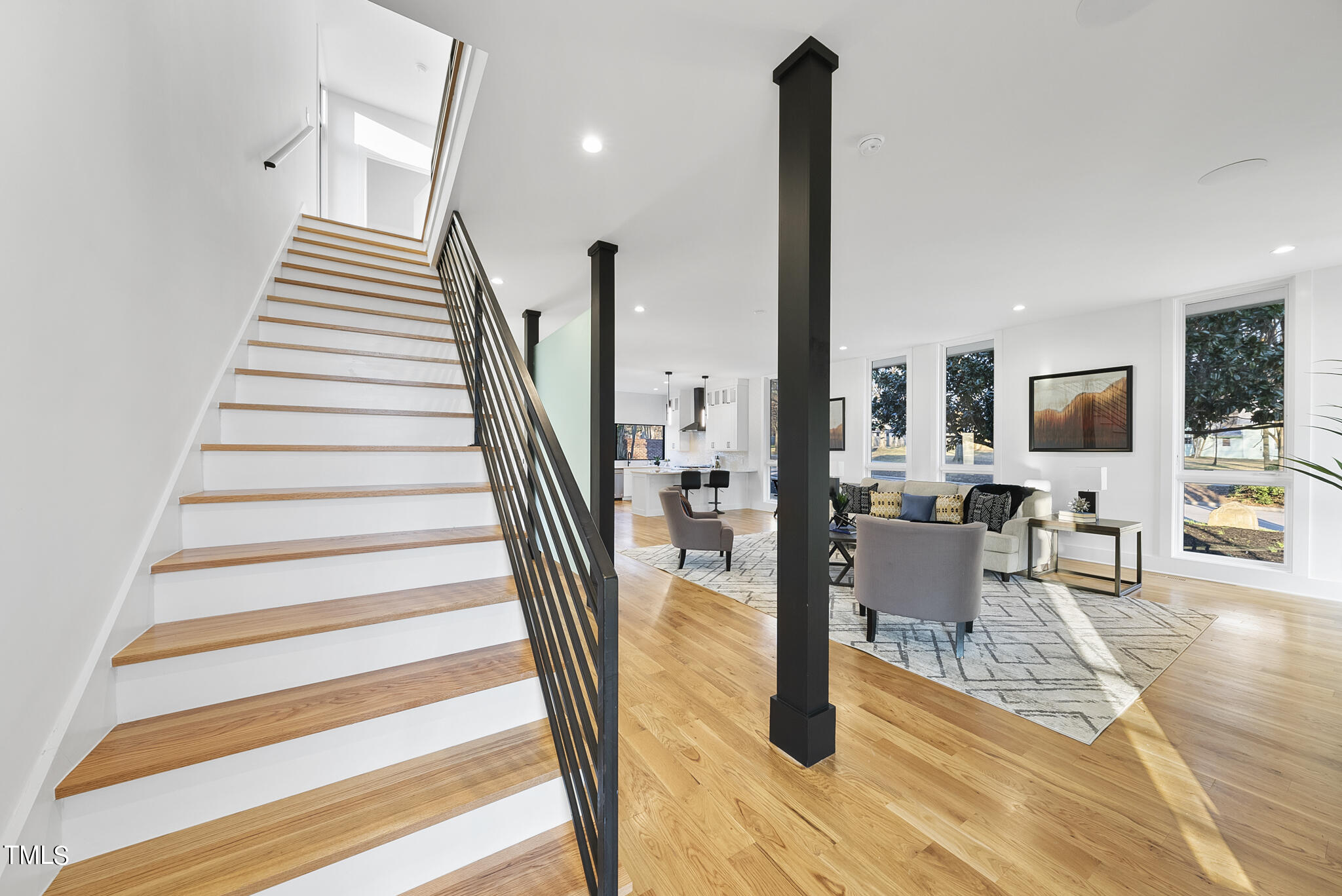 517 East Cabarrus Street Raleigh, NC 27601 - Photo 10 of 58 a view of staircase with living room and wooden floor
