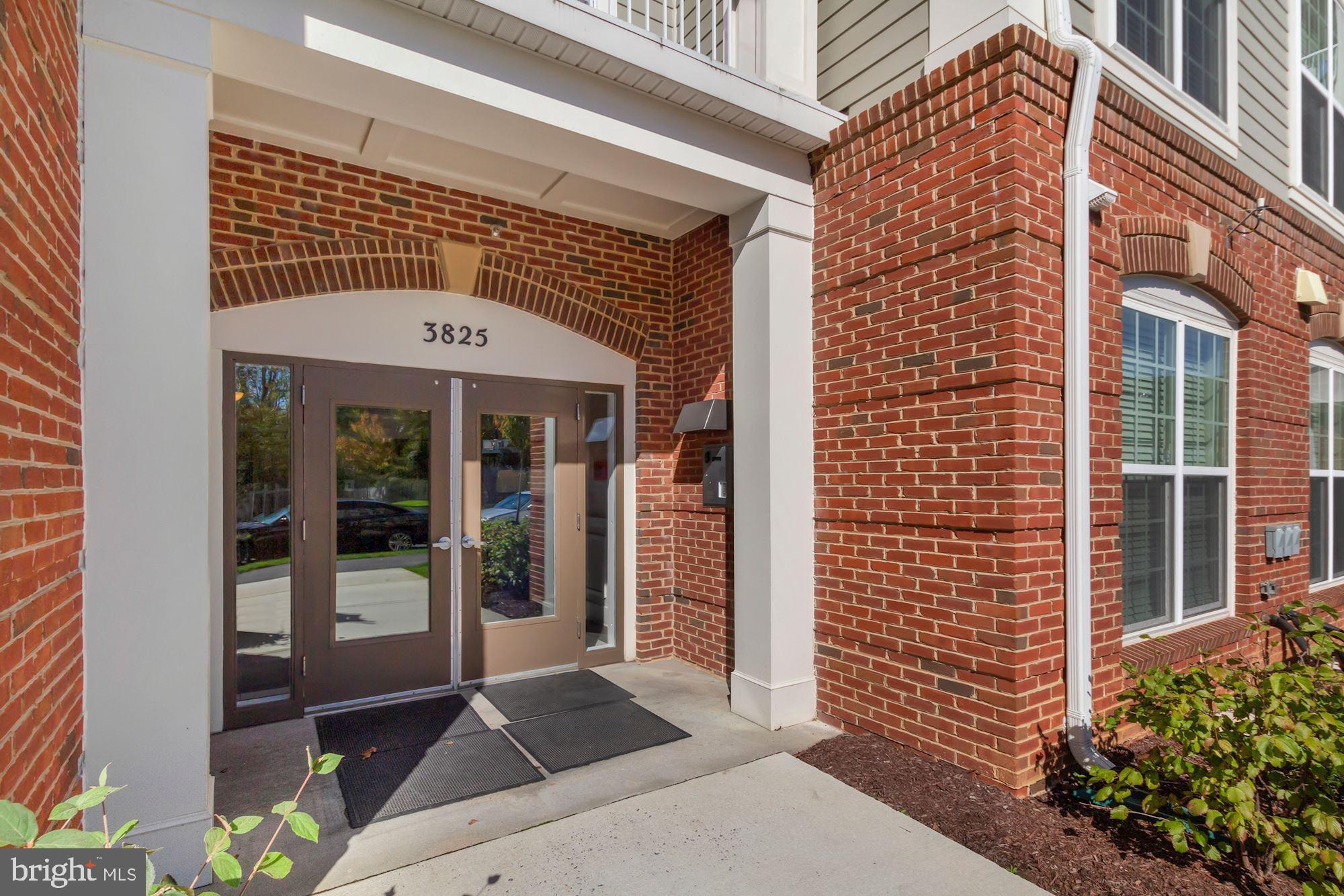 3825 Doc Berlin Drive, Unit 17 Silver Spring, MD 20906 - Photo 33 of 34 a front view of a building with glass door and glass windows