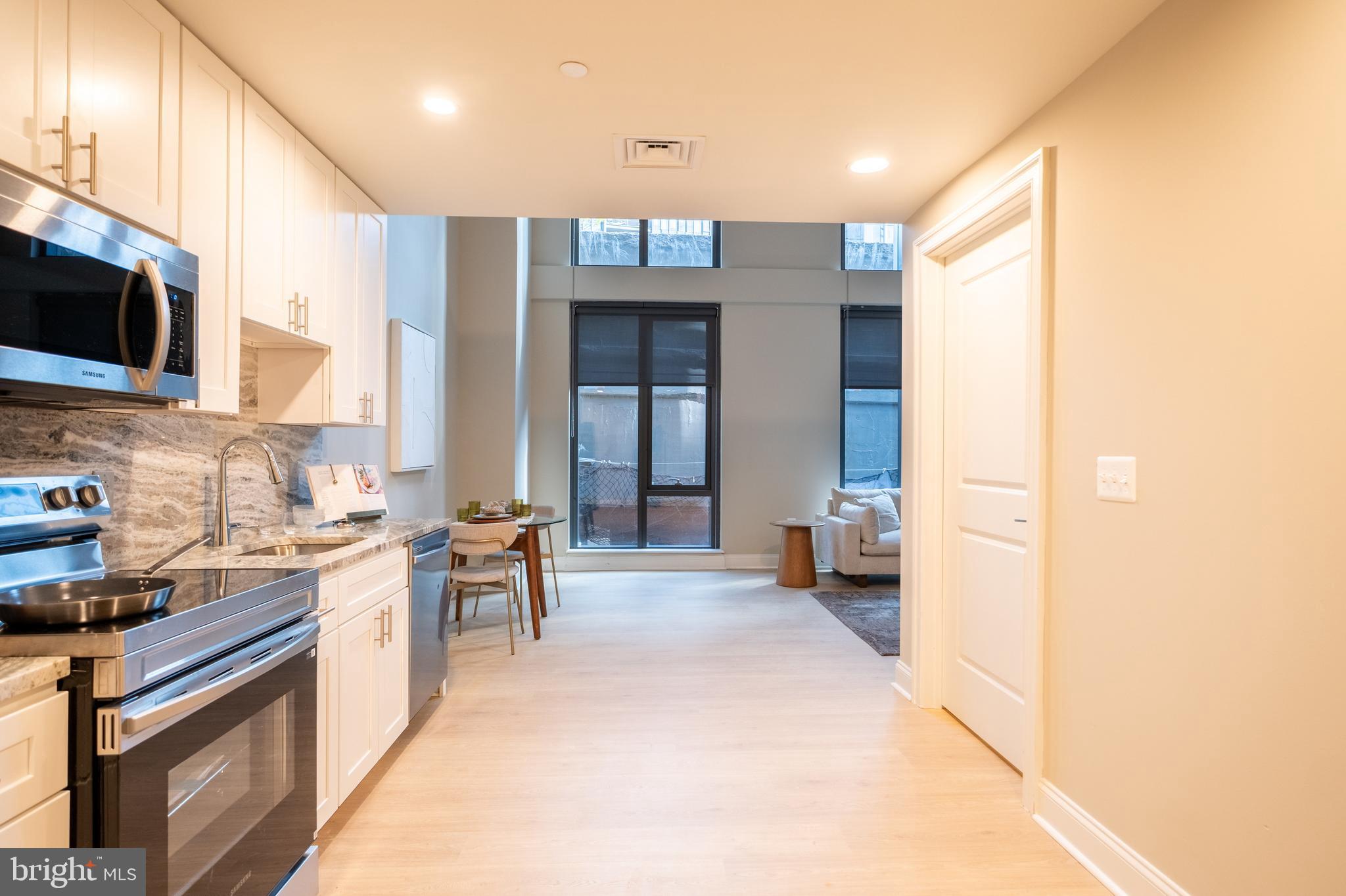 2301-61 John F Kennedy Boulevard, Unit 211 Philadelphia, PA 19103 - Photo 30 of 37 a kitchen with a sink cabinets and counter top space