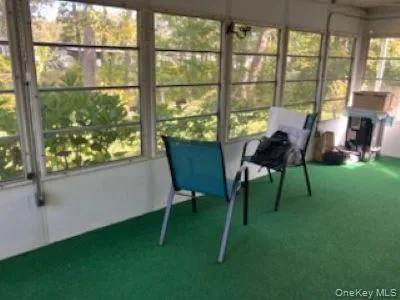 a view of a chairs and table in a yard