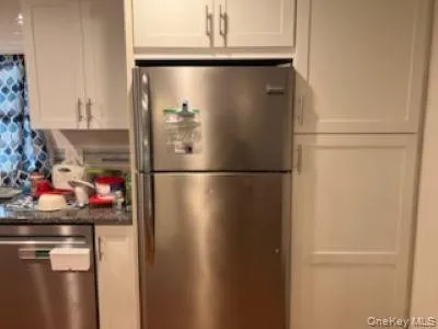 a close view of a refrigerator a washer and dryer