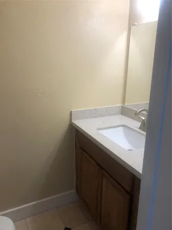 a bathroom with a sink and vanity