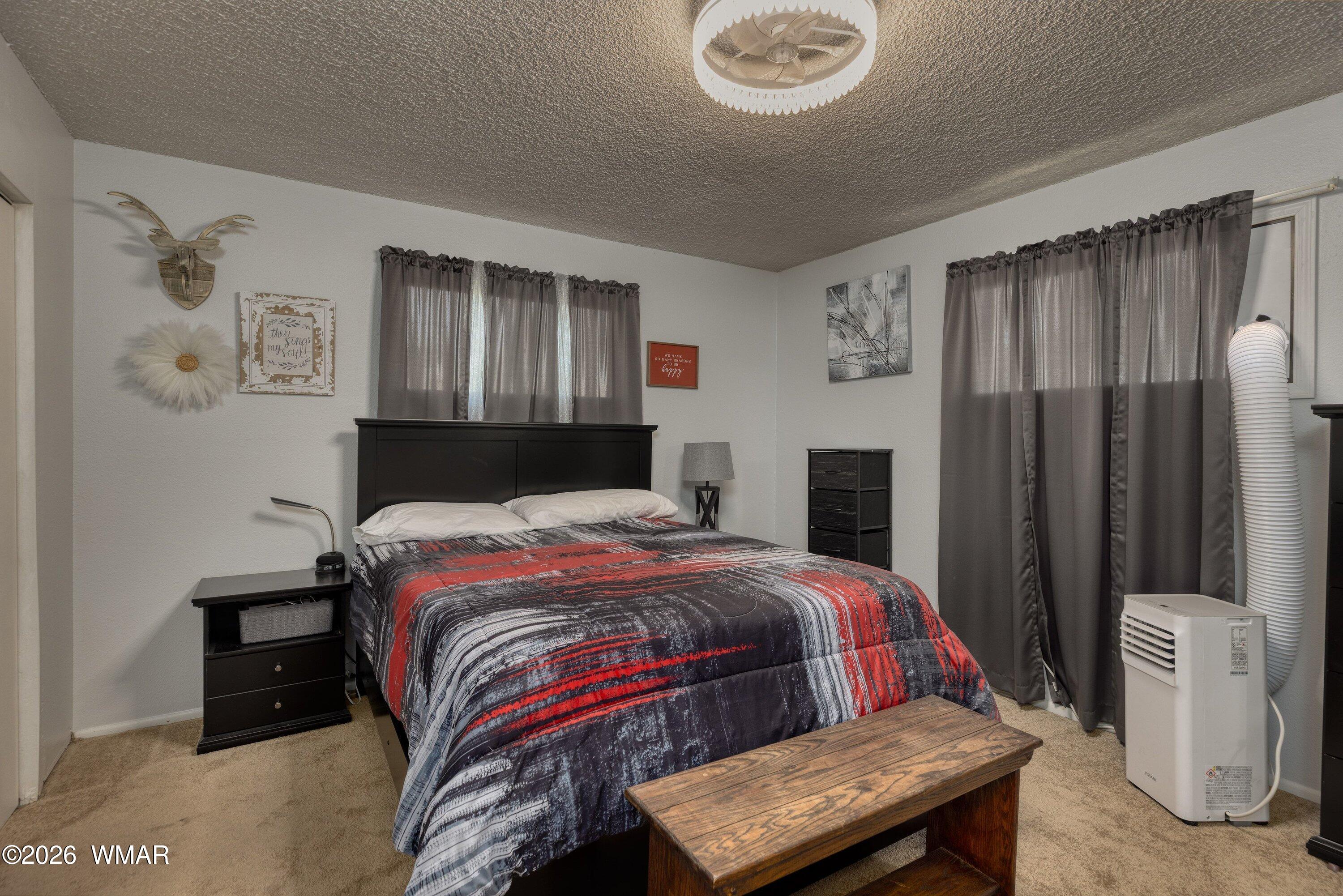 1114 Ranch Road Taylor, AZ 85939 - Photo 18 of 32 a bedroom with a bed and a dresser