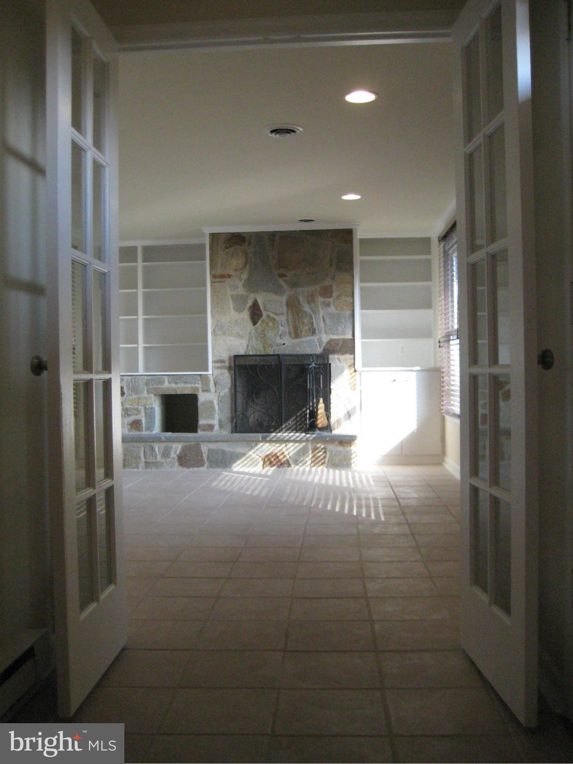 6148 Mt Phillip Road Frederick, MD 21703 - Photo 7 of 14 WOOD BURNING FIREPLACE AND BUILT IN SHELVING