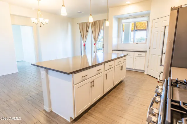 a kitchen with stainless steel appliances white cabinets and a stove