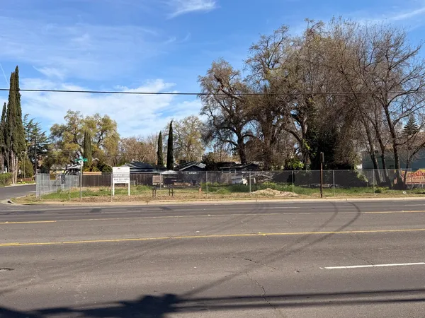 a view of a yard in front of a house