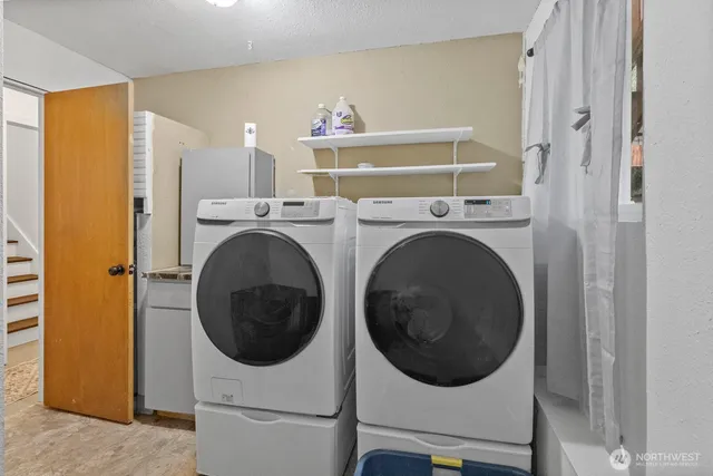 a utility room with dryer and washer