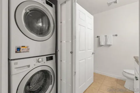 a view of a hallway with washer and dryer
