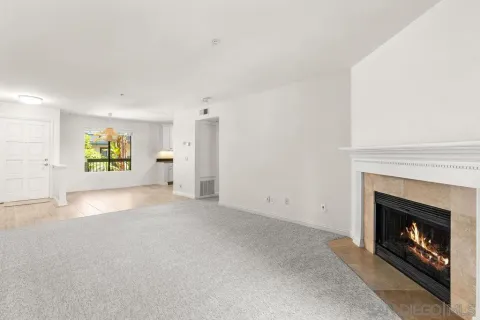 a view of an empty room with a fireplace