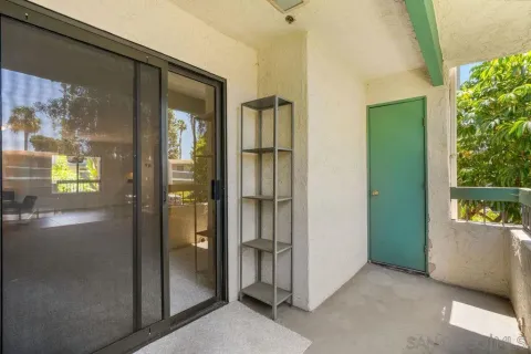 a view of an front door and bedroom